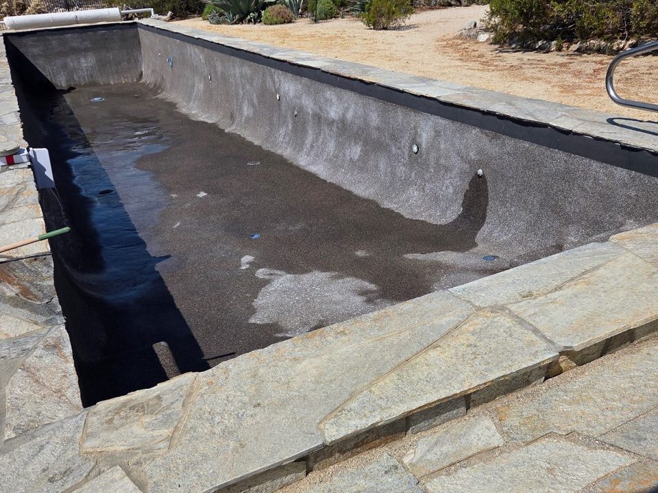Freshly refinished pool interior after a re-plaster by Aqua Fresh Pool Service in the Coachella Valley